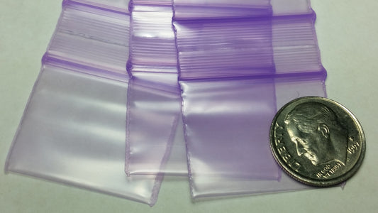 Purple resealable bags by Original Apple Bags, 1.25" x 1", ideal for storing small items or packaging.
