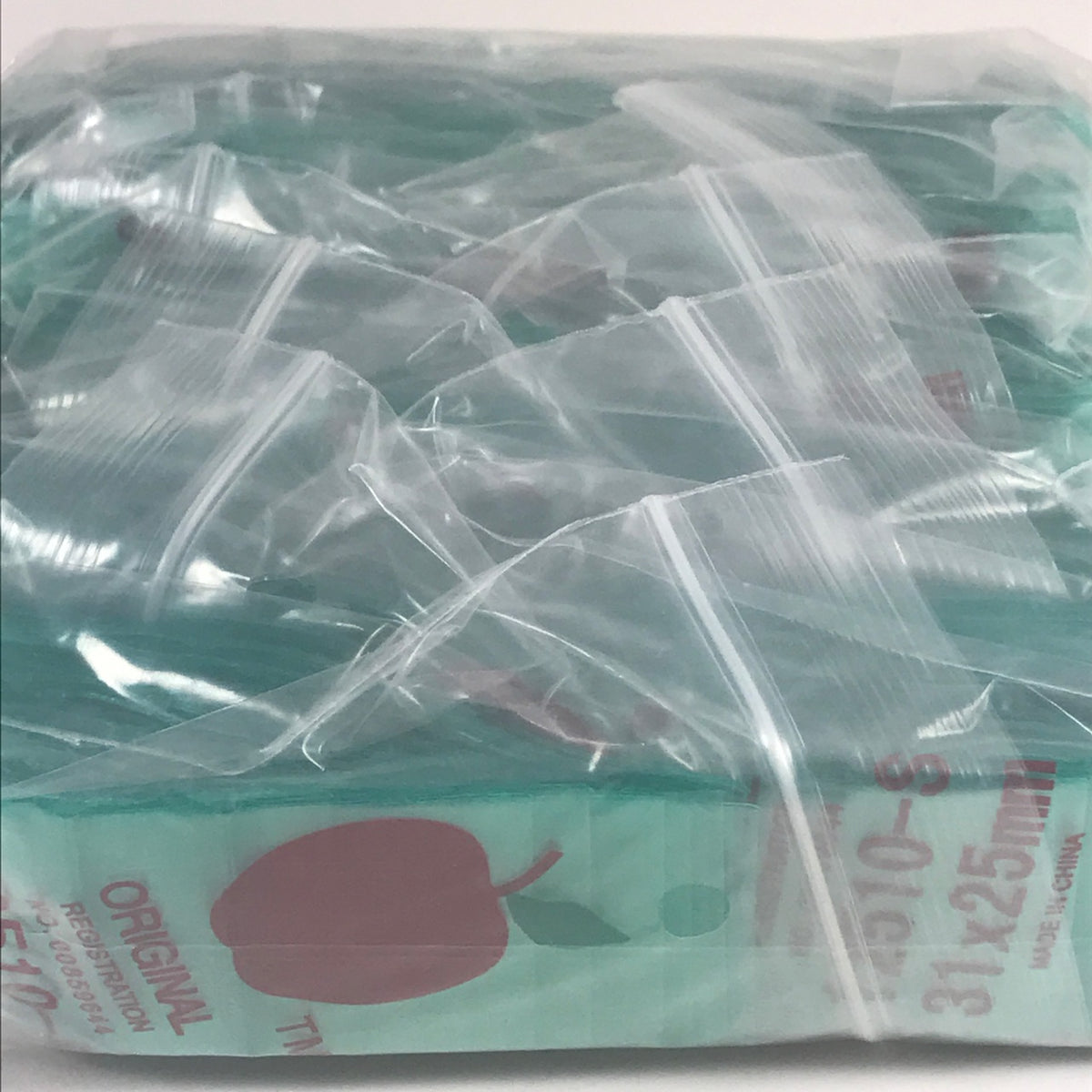 Green Original Apple Bags resealable bags, 1.25" x 1", designed for storing small items or produce.