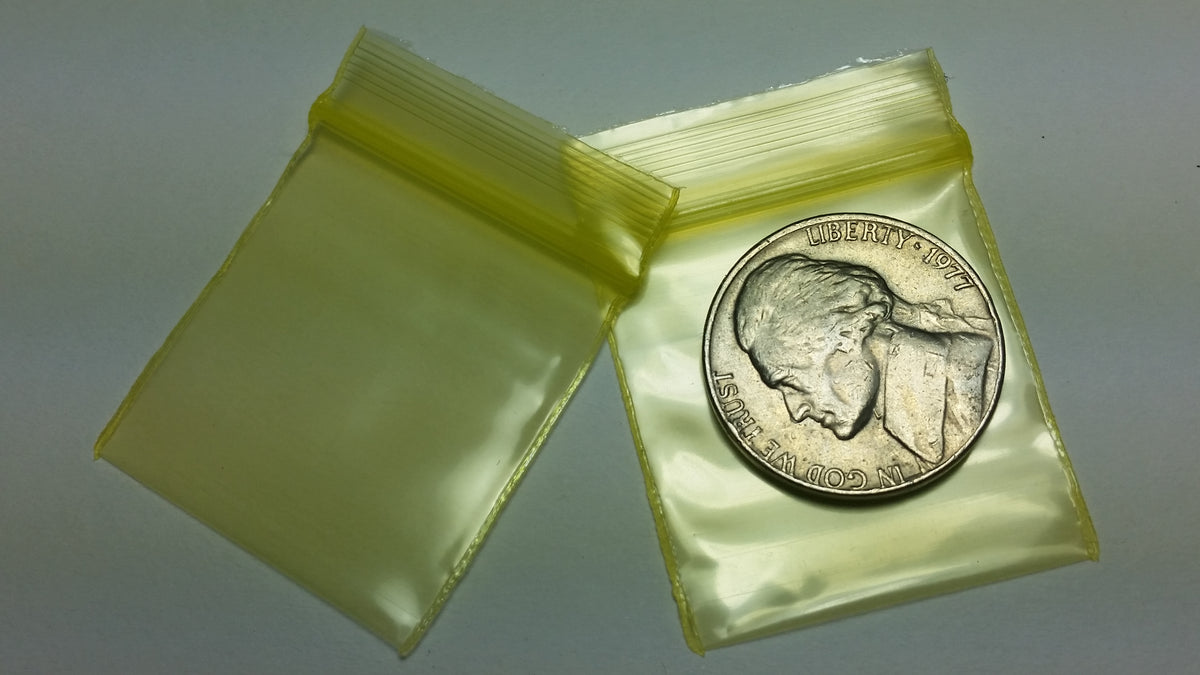 Yellow resealable bags from Original Apple Bags, 1.25 x 1.25 inches, ideal for storing small items or snacks.