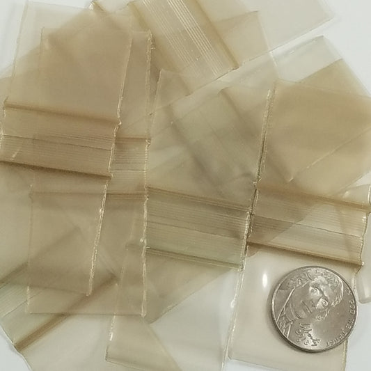 Gold 1.25 x 1.25-inch resealable Original Apple Bags with a clear window, perfect for packaging small items.