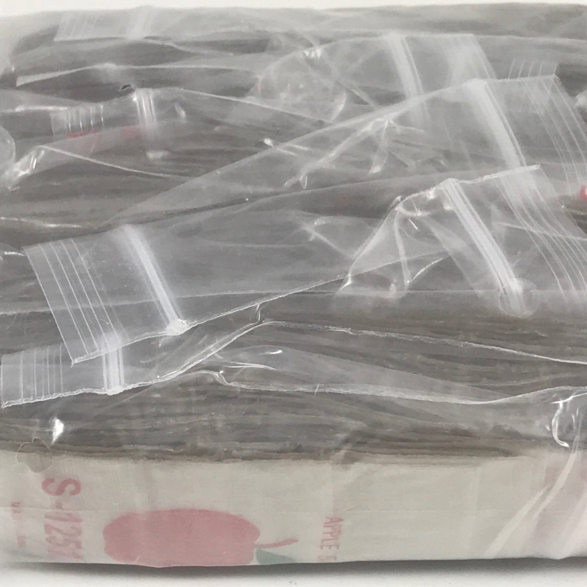 Gold resealable Apple Bags by Original Apple Bags, 1.25 x 1.25 inches, ideal for packaging small items or gifts.