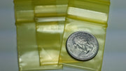Original Apple Bags resealable yellow bags, 1.25" x 1.5", ideal for packaging small items and snacks.