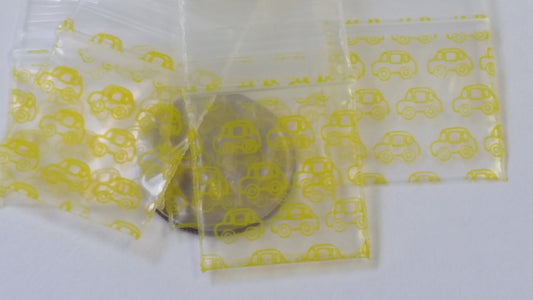 Original Apple Bags resealable bags in taxi cab yellow, 3/4 inch by 3/4 inch, ideal for packaging or storage.