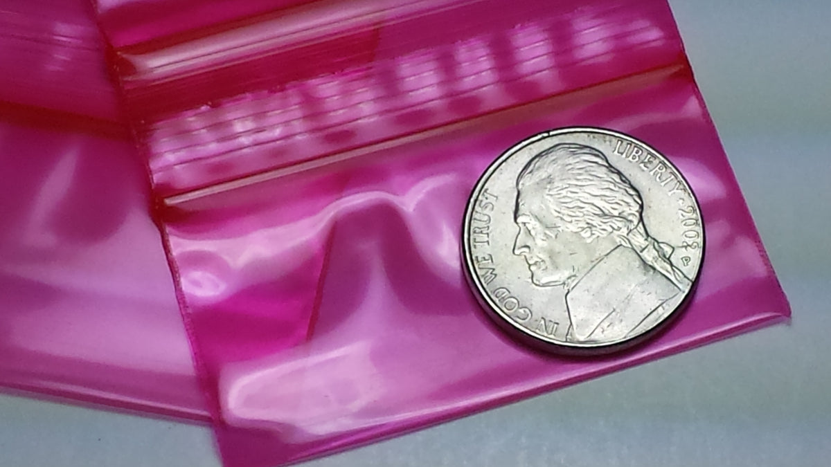 Red 2x1-inch resealable bags from Original Apple Bags, ideal for storage or packaging purposes.