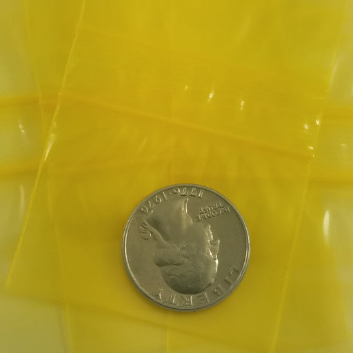 Yellow 2015 Original Apple Bags resealable bags, 2x1.5 inches, made by Original Apple Bags for storing small items.