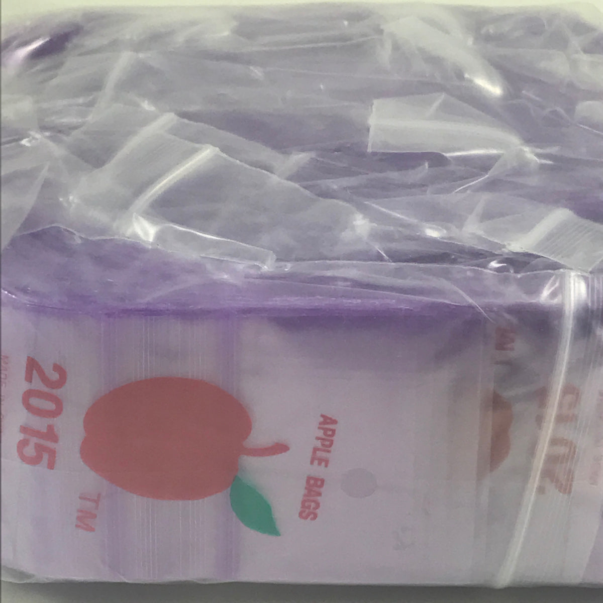Purple resealable bags by Original Apple Bags, 2x1.5 inches, made of durable material for storage and organization.