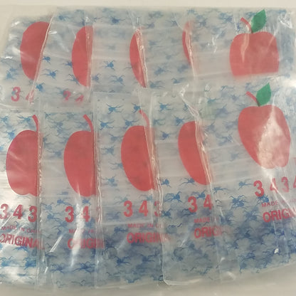 Resealable Apple Bags by Original Apple Bags, 3/4" x 3/4" smoke and fly design, suitable for storing small items or snacks.