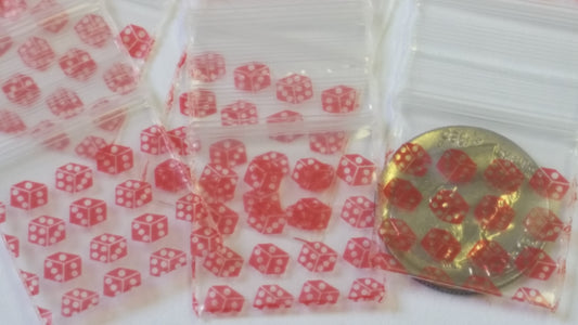 Resealable Original Apple Bags with red dice design, 3/4 inch by 3/4 inch, ideal for storing small items.
