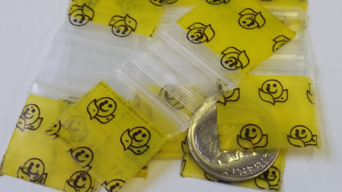 Resealable Original Apple Bags with happy face design, 3/4" x 3/4" size, perfect for storing small items or snacks.