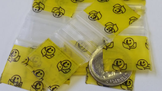 Resealable Original Apple Bags with happy face design, 3/4" x 3/4" size, perfect for storing small items or snacks.