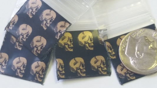 Resealable gold skull design Original Apple Bags, 3/4" x 3/4" size, ideal for storing small items or collectibles.