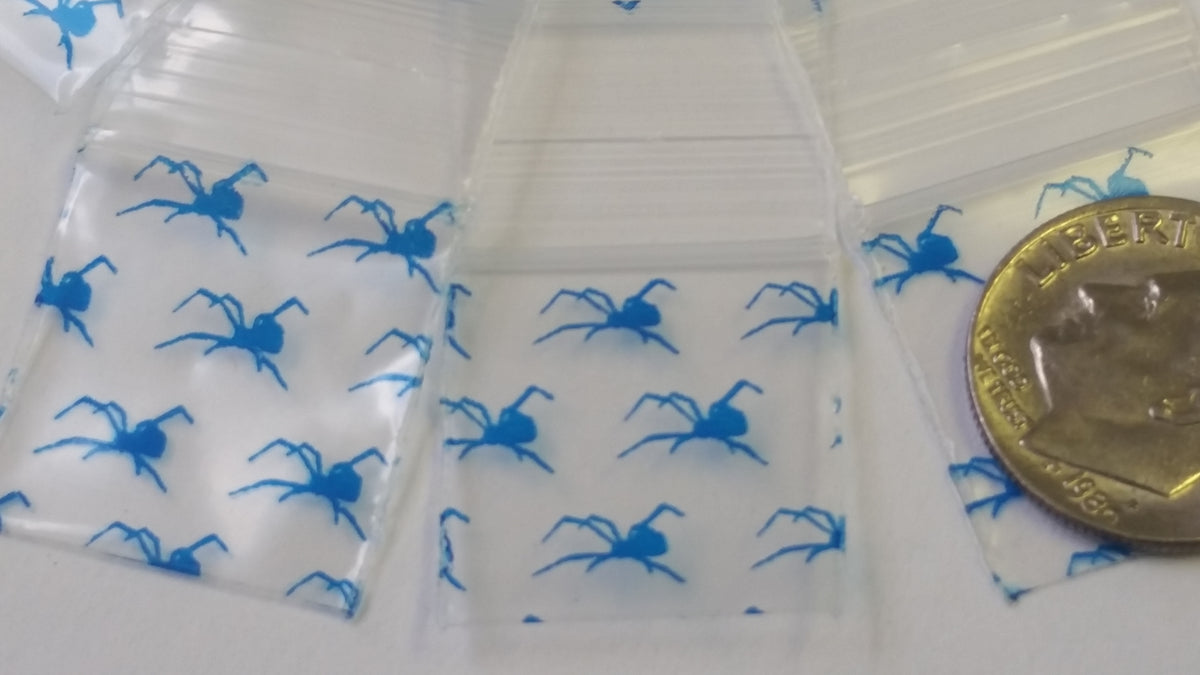 Blue Spider 3/4" x 3/4" resealable bags by Original Apple Bags, featuring a clear design with blue spider pattern.