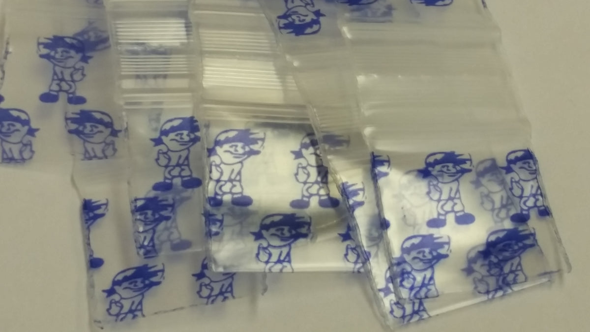 Blue Boy 3/4" x 3/4" resealable bags by Original Apple Bags, featuring a colorful design and transparent material.