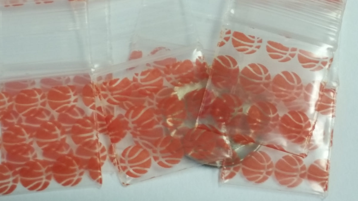 Original Apple Bags resealable bags with basketball design, 3/4 inch by 3/4 inch, ideal for packaging or storage.
