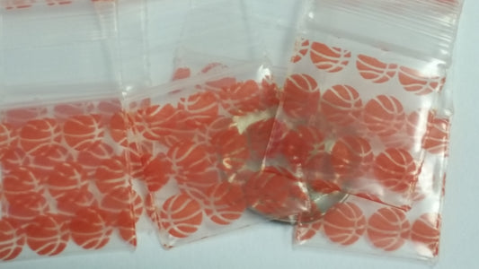 Original Apple Bags resealable bags with basketball design, 3/4 inch by 3/4 inch, ideal for packaging or storage.