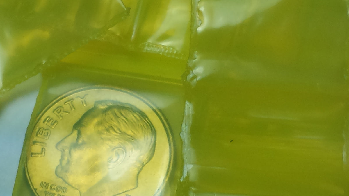 Yellow resealable bags from Original Apple Bags, 3/4 inch by 3/4 inch, ideal for packaging small items.