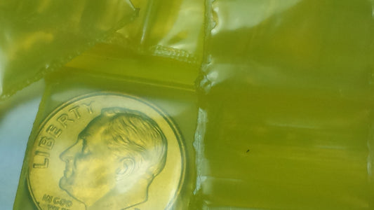 Yellow resealable bags from Original Apple Bags, 3/4 inch by 3/4 inch, ideal for packaging small items.