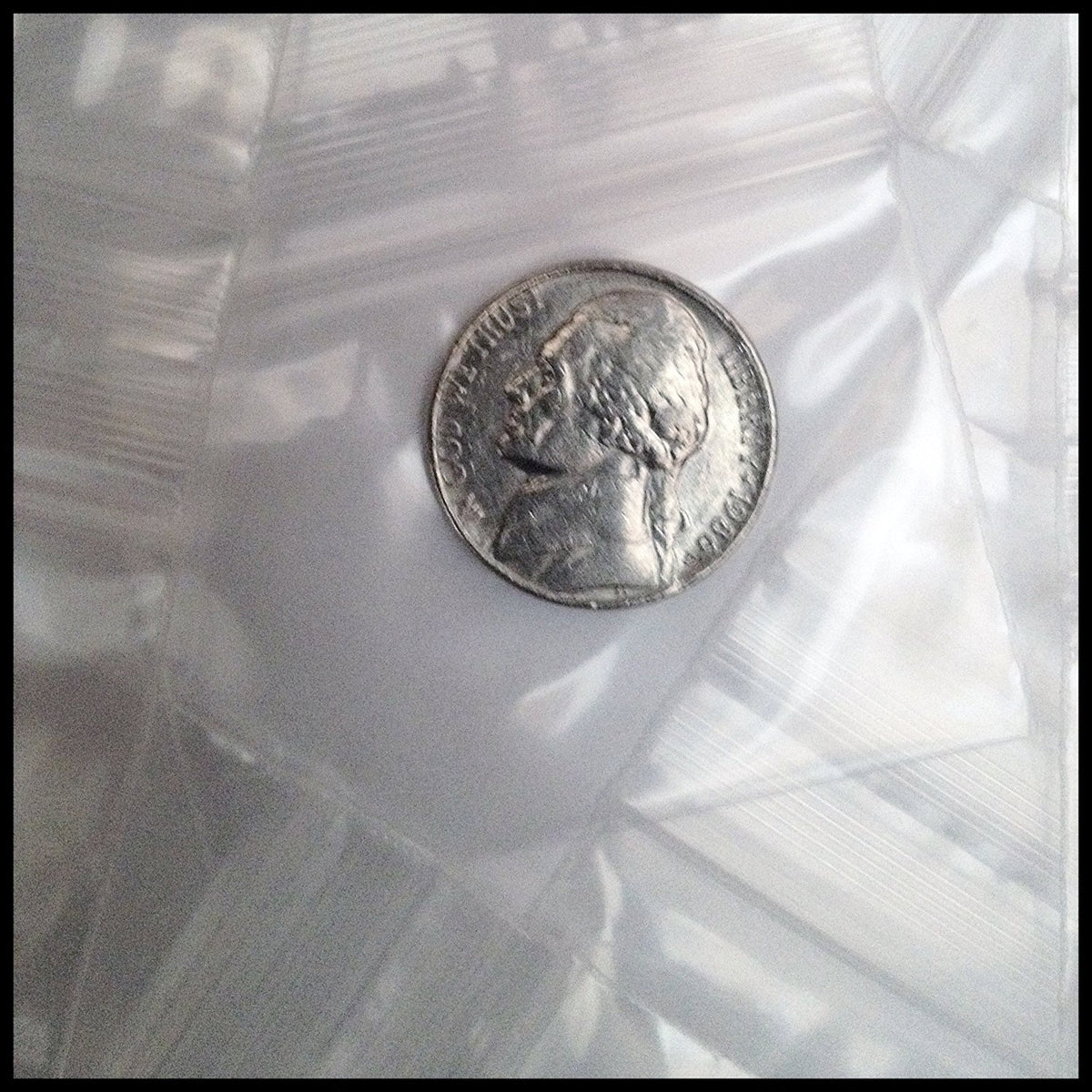 Clear resealable bags by Original Apple Bags, 2x1.5 inches, perfect for storing small items or packaging.