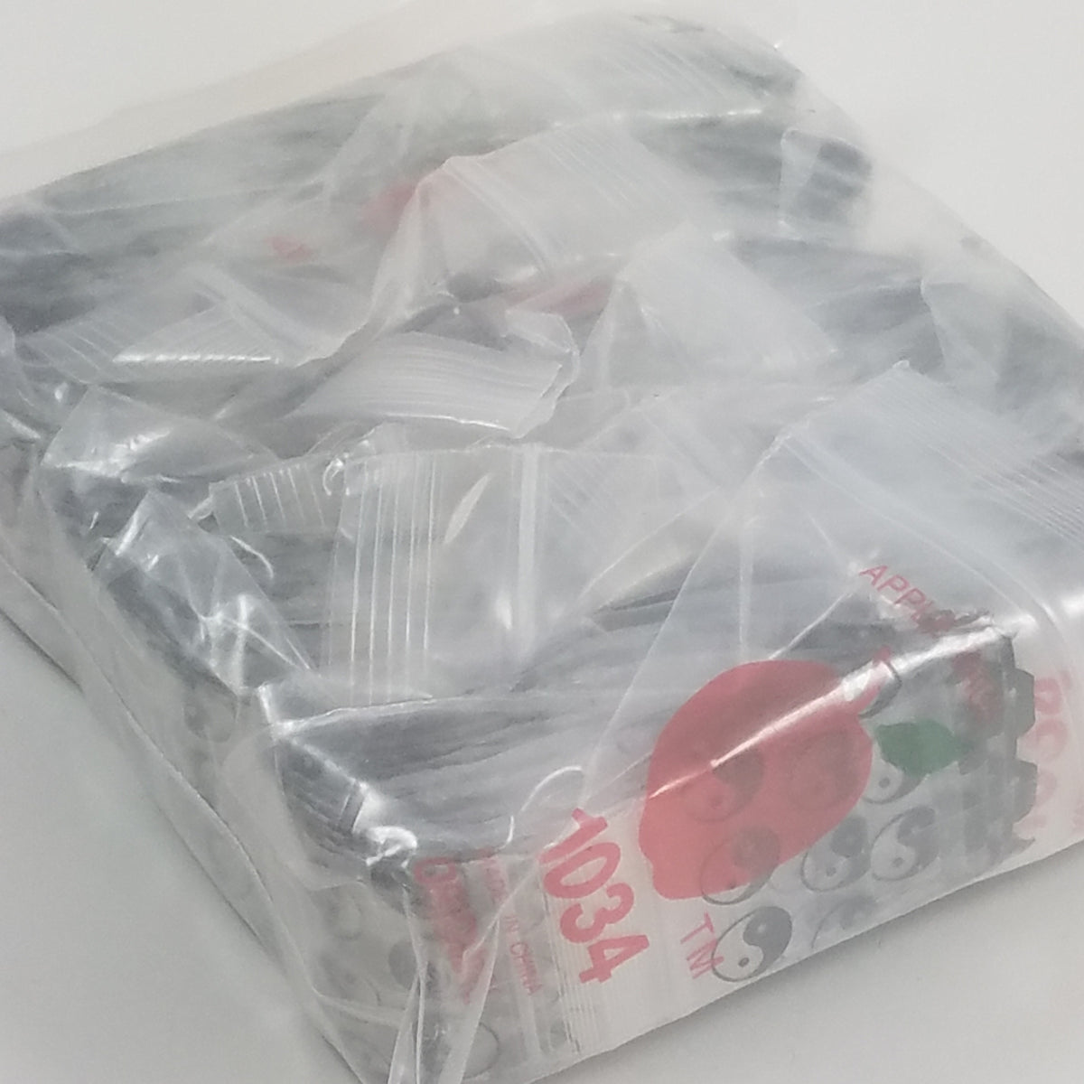 Resealable Original Apple Bags with TaiJi/Yin Yang design, 1 inch by 3/4 inch, featuring black and white yin-yang motif.