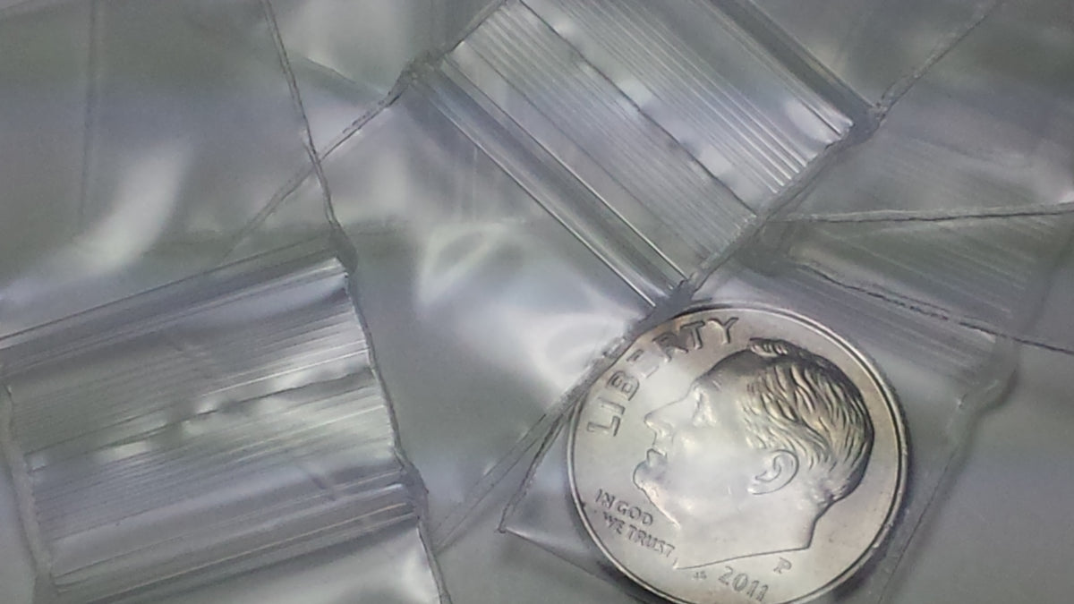 Clear 3/4" x 3/4" resealable bags from Original Apple Bags, perfect for storing small items or crafts.