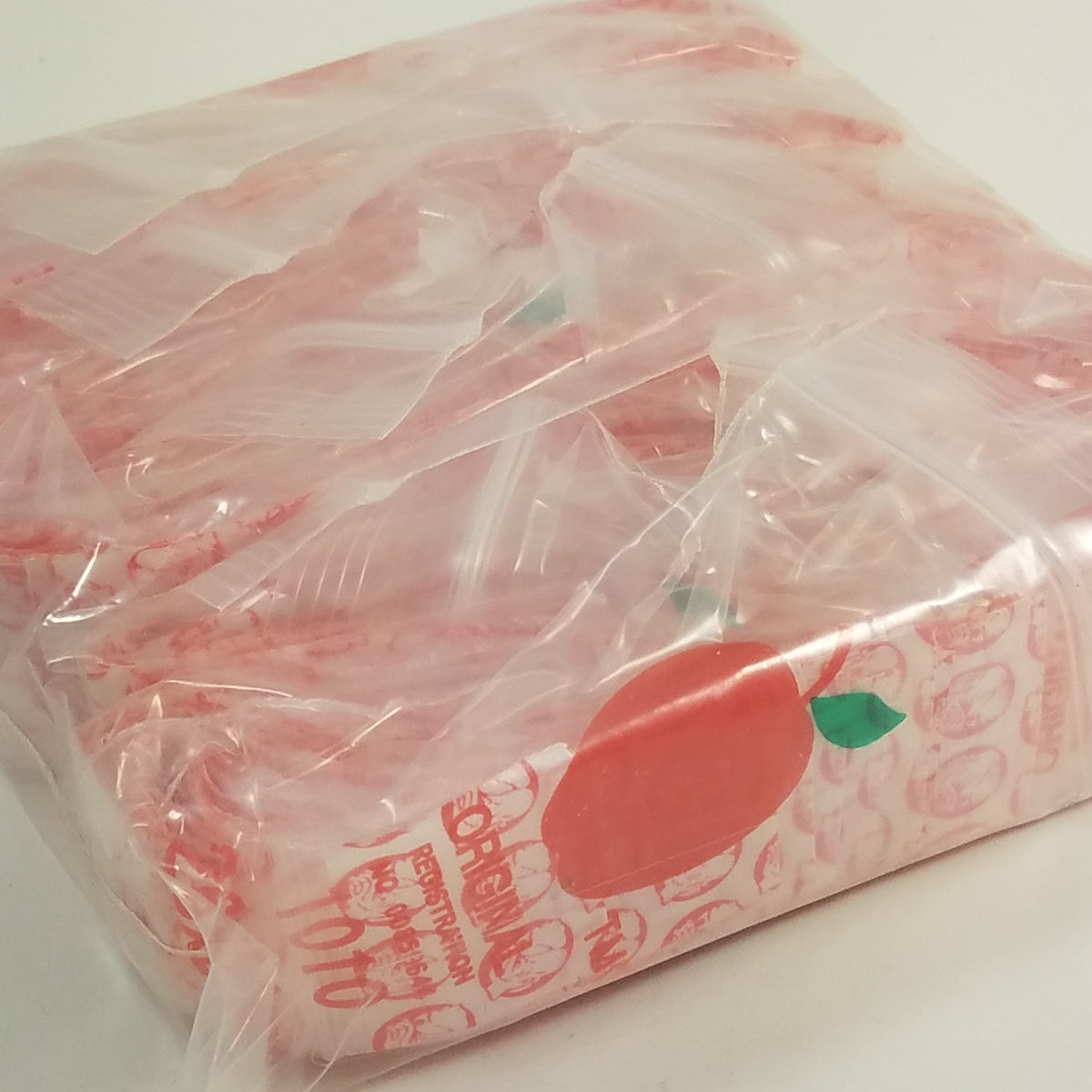 Red dog-themed 1x1 inch resealable Apple Bags by Original Apple Bags, perfect for packaging small items or gifts.