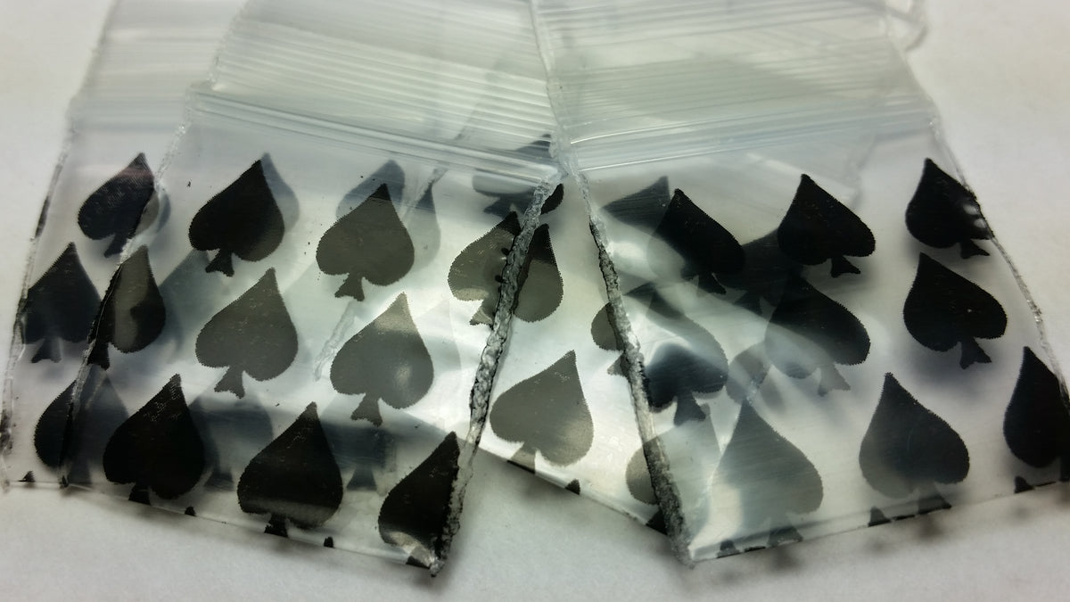 Original Apple Bags spade-shaped paper bag, 1.25" x 3/4" size, for gift packaging or retail displays.