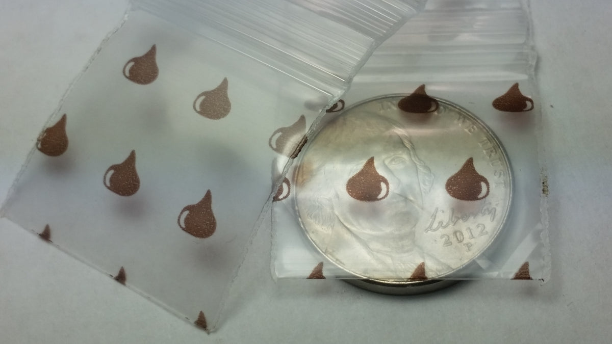 Purple 1"x1" resealable bags from Original Apple Bags, perfect for packaging small items or gifts.