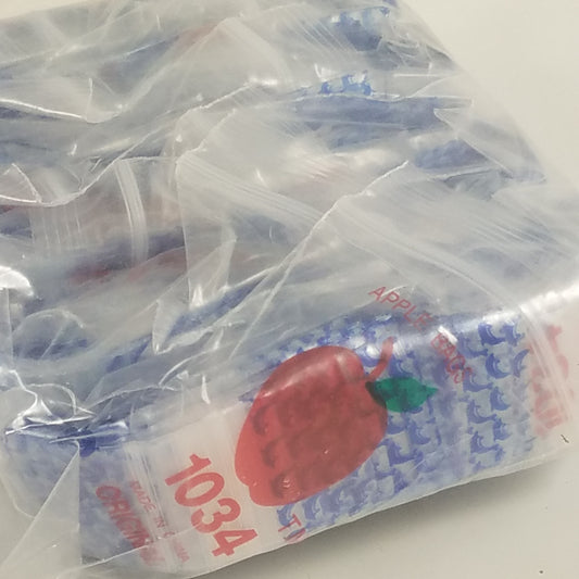 Resealable Original Apple Bags with dolphin print, 1 inch by 3/4 inch, perfect for packaging small items or gifts.
