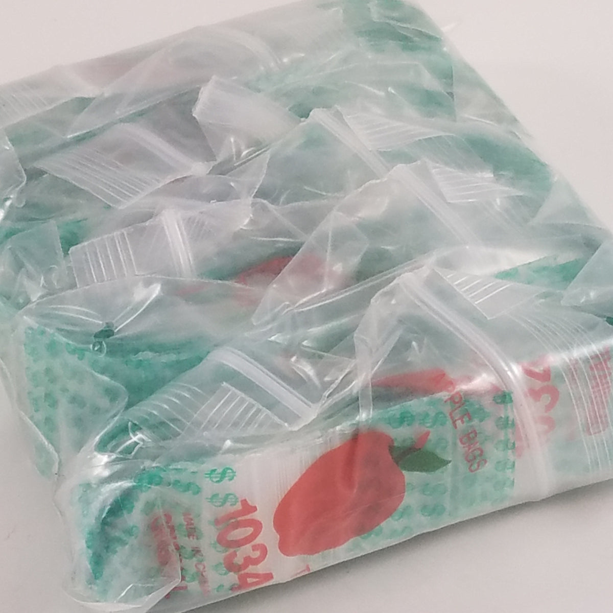Original Apple Bags resealable bags with dollar sign ($) design, 1" x 3/4" size, ideal for packaging and storage.
