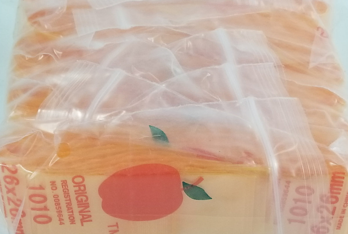 Orange 1x1 inch resealable bags from Original Apple Bags, perfect for storage and organization.