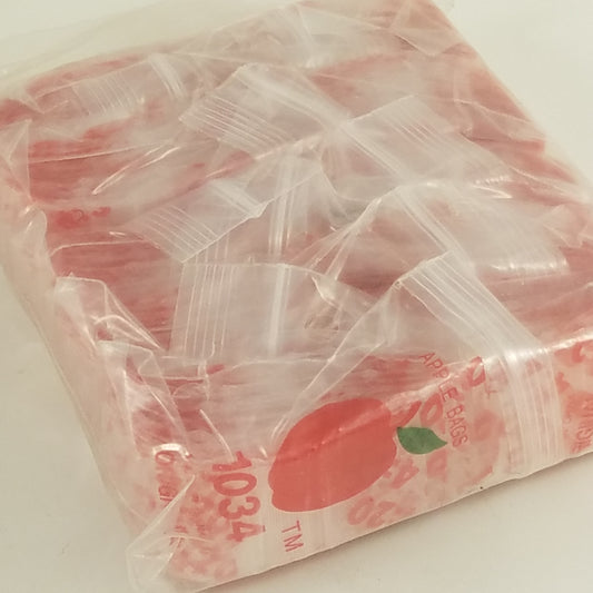 Original Apple Bags resealable plastic bags, 1" x 3/4" size, shown with secure closure and transparent design.