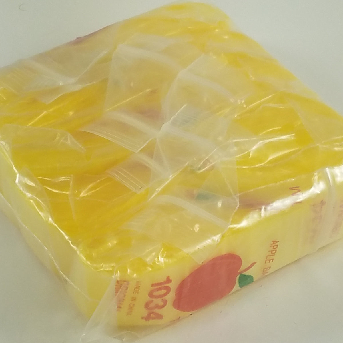 Yellow resealable bags by Original Apple Bags, 1 inch by 3/4 inch, ideal for packaging and storage.