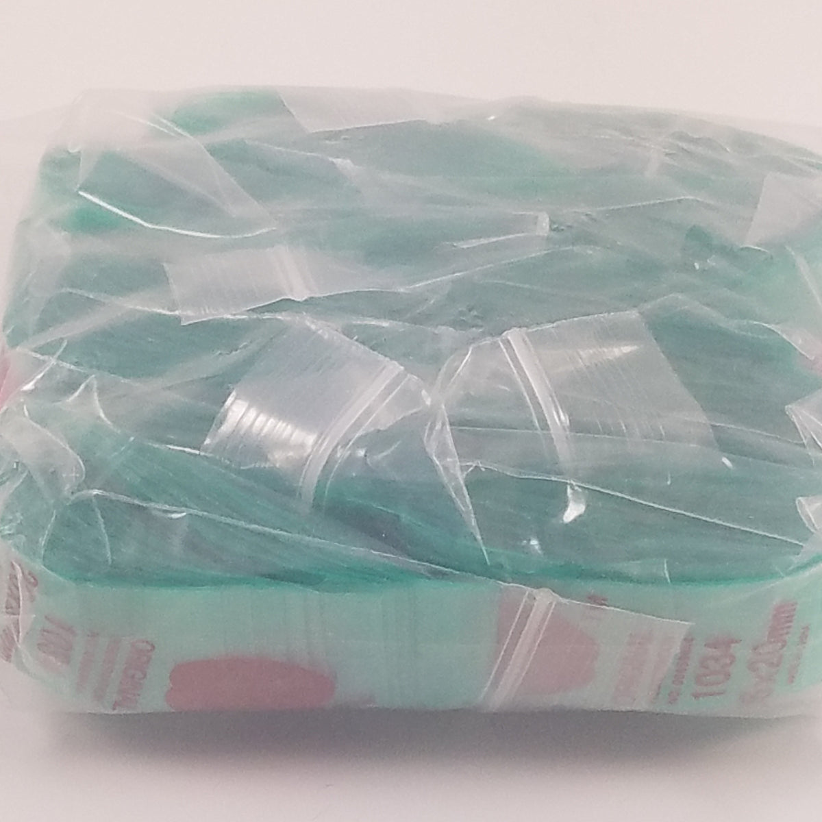 Green 1" x 3/4" resealable bags by Original Apple Bags, ideal for storage and organization.