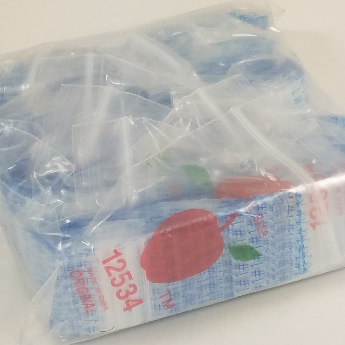 Original Apple Bags resealable bags, 1.25 x 0.75 inches, ideal for packaging small items or gifts.