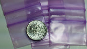 Purple Original Apple Bags resealable bags, 1.25" x 3/4", with a natural look, suitable for storing small items or snacks.