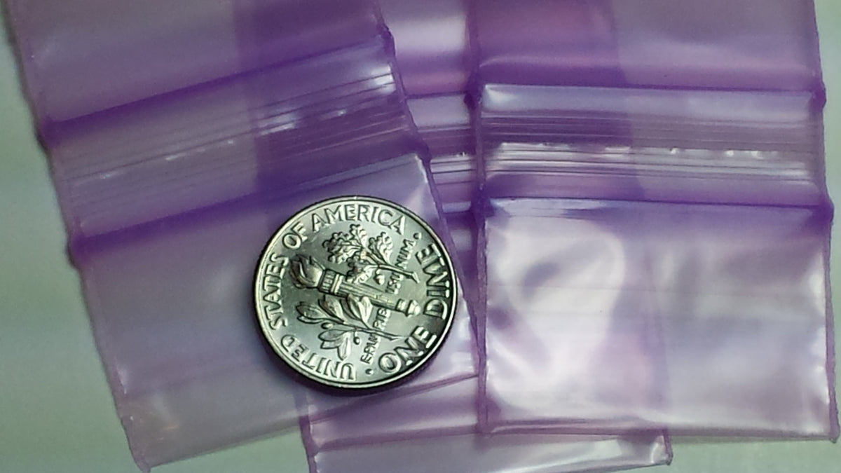 Purple Original Apple Bags resealable bags, 1.25" x 3/4", with a natural look, suitable for storing small items or snacks.