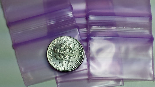 Purple Original Apple Bags resealable bags, 1.25" x 3/4", with a natural look, suitable for storing small items or snacks.