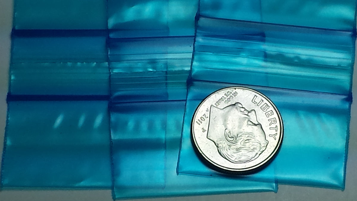 Blue resealable Apple Bags, 1.25 x 0.75 inches, made by Original Apple Bags, shown with their transparent material and secure seal.