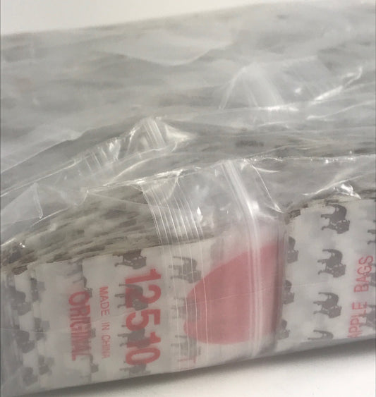 Resealable Original Apple Bags with top dog design, 1.25" x 1", ideal for packaging small items or treats.
