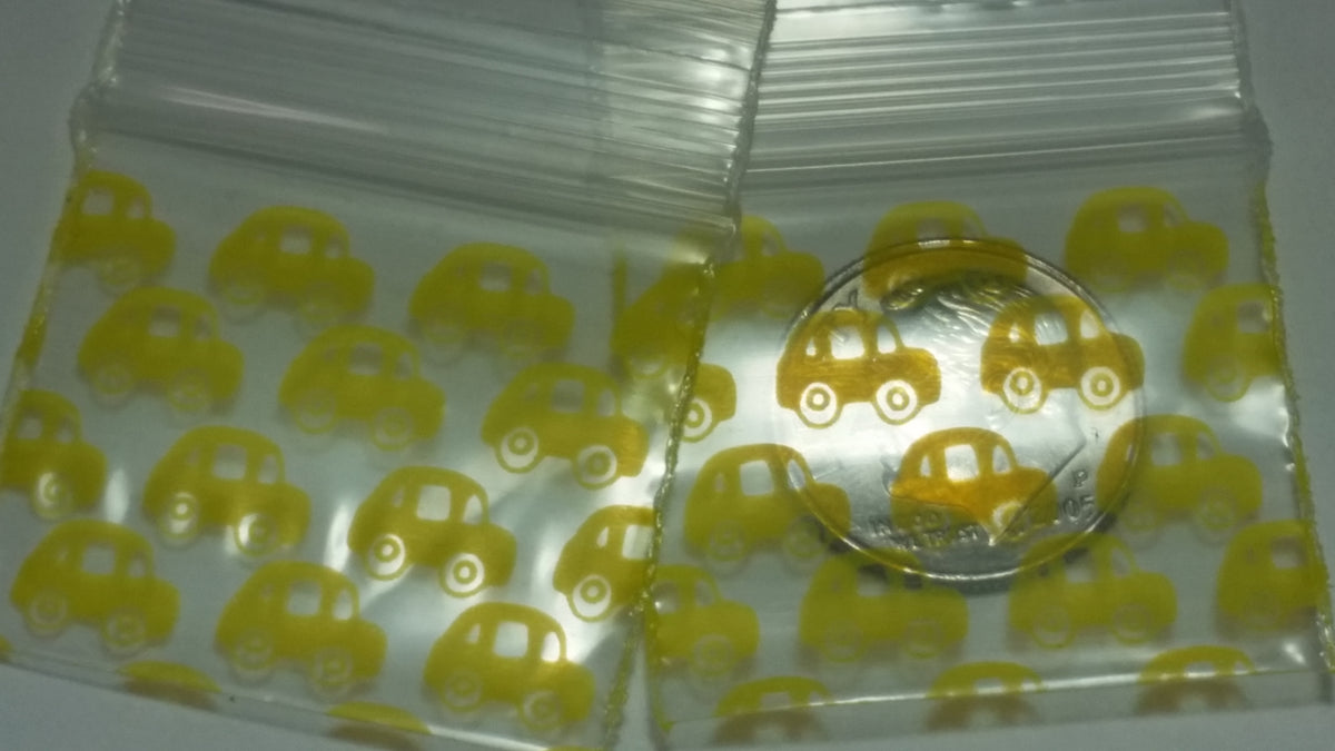 Original Apple Bags resealable taxi cab-themed bags, 1.25" x 1", ideal for packaging small items or candies.