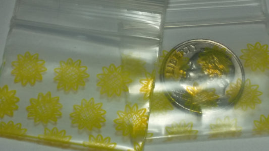 Original Apple Bags sunflower-themed resealable bags, 1.25" x 1", with bright sunflower designs and secure closure.