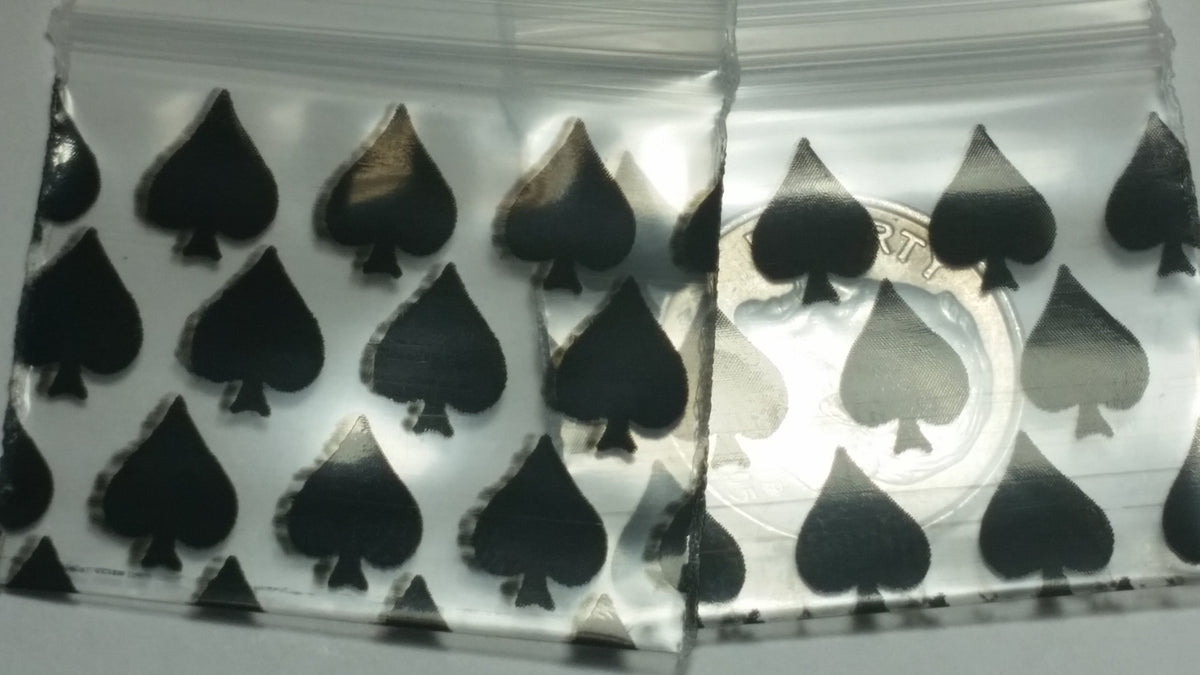 Original Apple Bags resealable spade-shaped plastic bags, 1.25"x1", ideal for packaging and storage.
