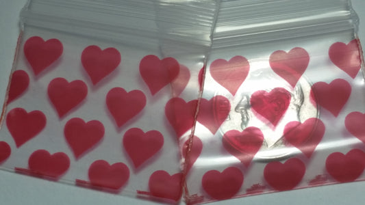 Original Apple Bags resealable bags with heart-shaped design, measuring 1.25" x 1" for packaging or storage.