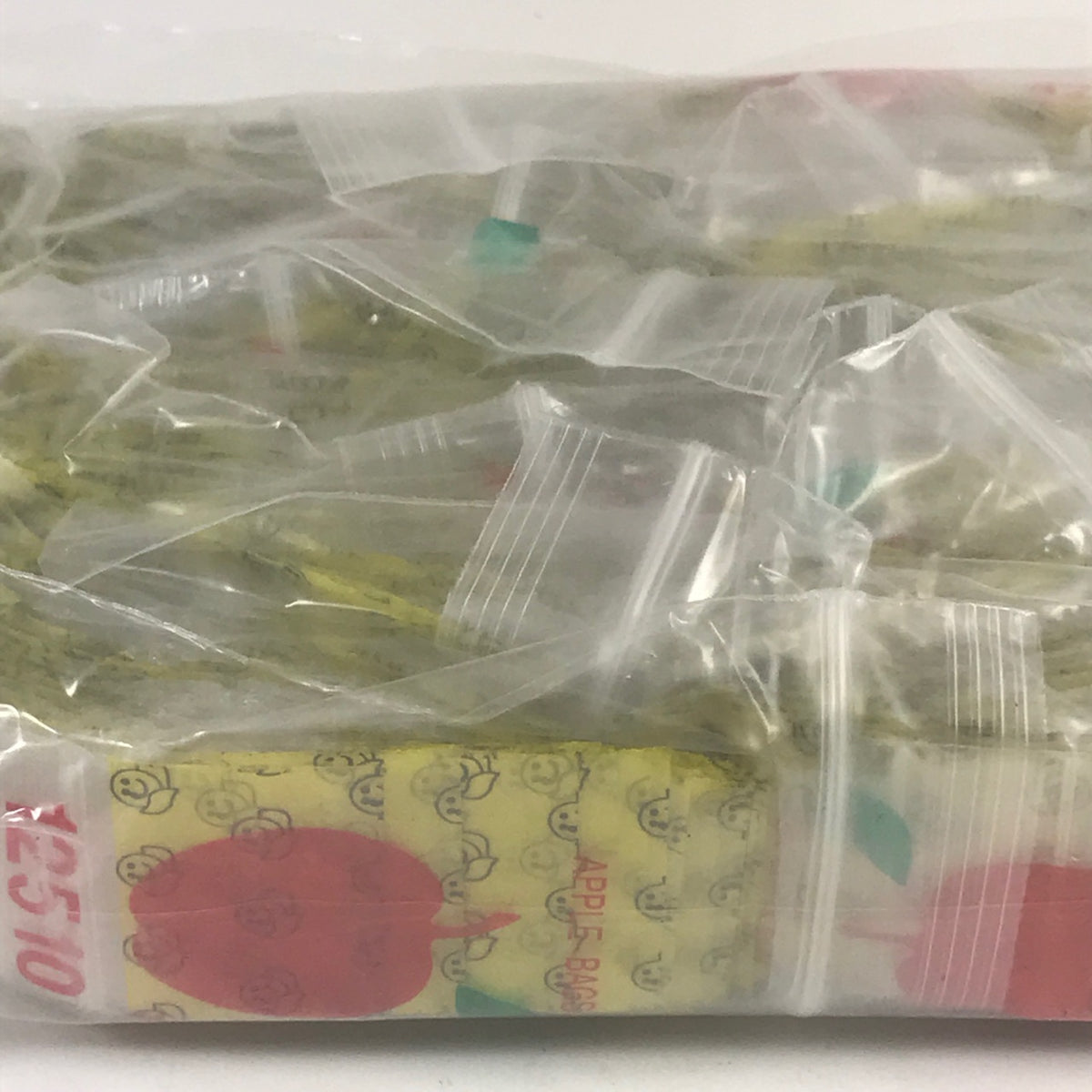Original Apple Bags resealable bags with happy face design, measuring 1.25" x 1" for packaging or storage.