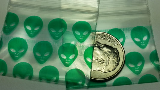 Green Alien-themed resealable bags from Original Apple Bags, 1.25" x 1", featuring fun alien designs on the packaging.