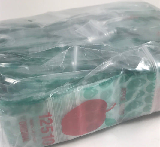Green Alien resealable bags from Original Apple Bags, 1.25" x 1", ideal for storage or packaging.
