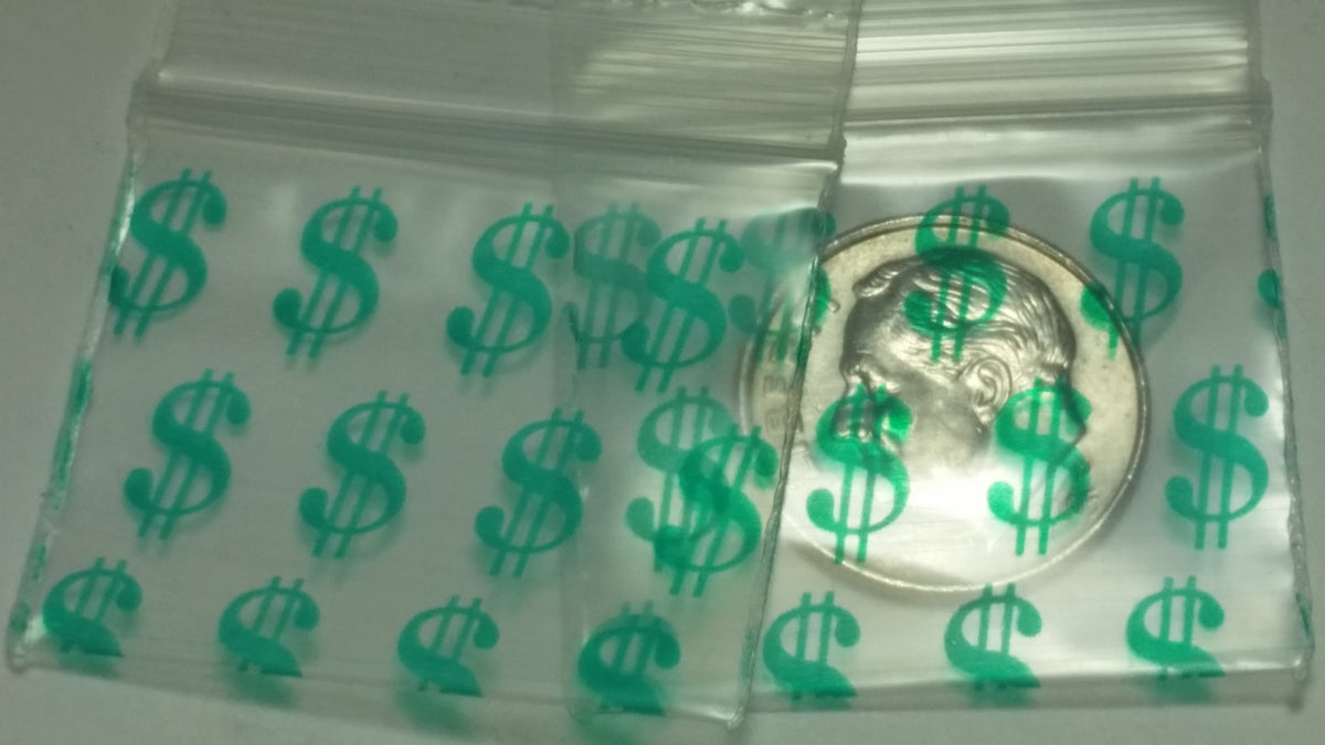 Original Apple Bags resealable bags with dollar sign, 1.25" x 1", ideal for packaging small items or crafts.