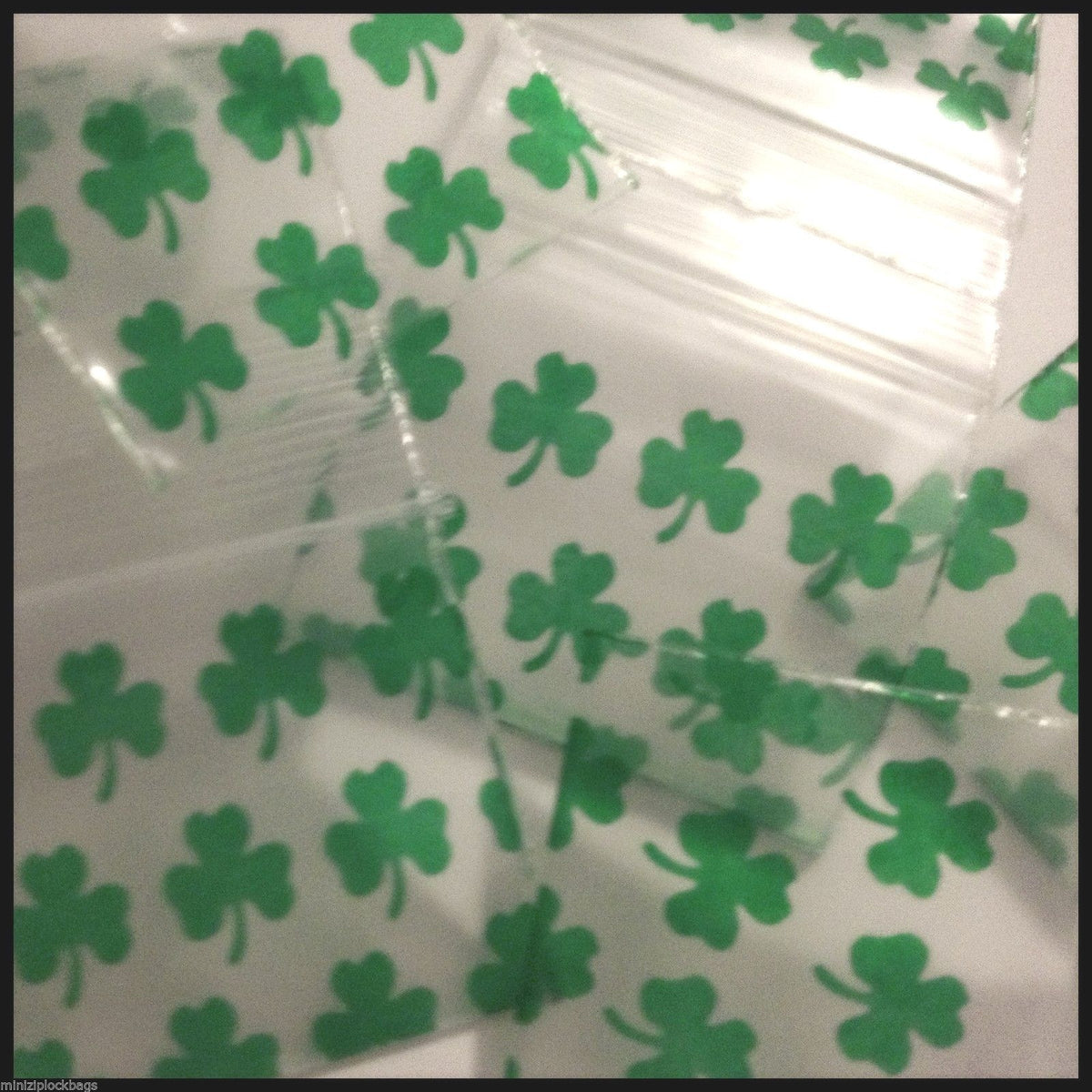 Original Apple Bags resealable clover-shaped plastic bags, 1.25 x 1 inch, ideal for packaging small items.