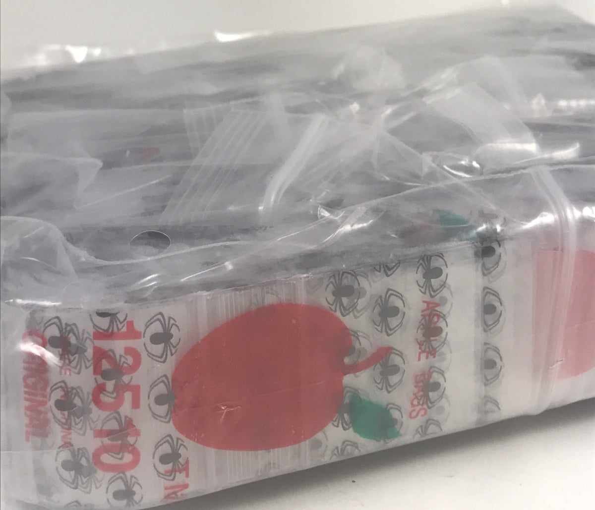 Black Spider design resealable Apple Bags, 1.25 x 1 inch, made by Original Apple Bags for secure storage and packaging.