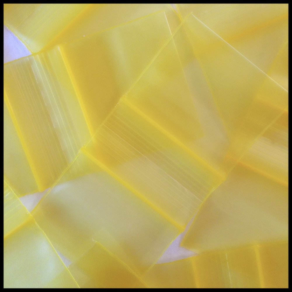Yellow resealable bags from Original Apple Bags, 1.25 x 1 inch, ideal for storing small items or crafts.
